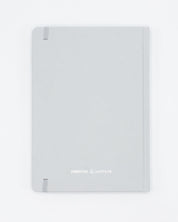 A Cognitive Surplus Skeleton A5 Hardcover Notebook - Dotted Lines on a white surface.